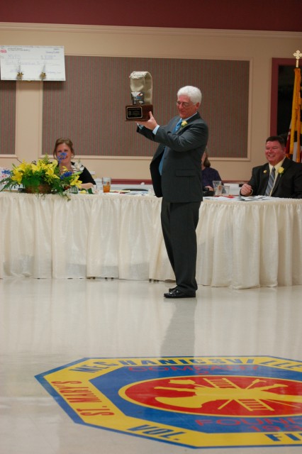 Engineer Dennis Hooker with his award for laying the most hose off of our rigs in 2007